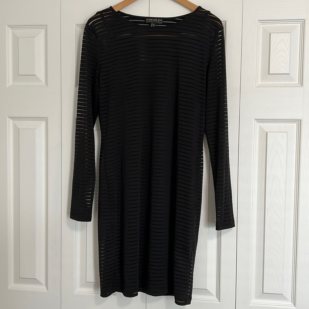 Form fitting long sleeve black dress